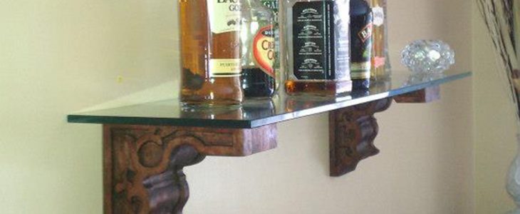 Beautiful Glass Shelf accented with Wooden Hand Carved Corbels